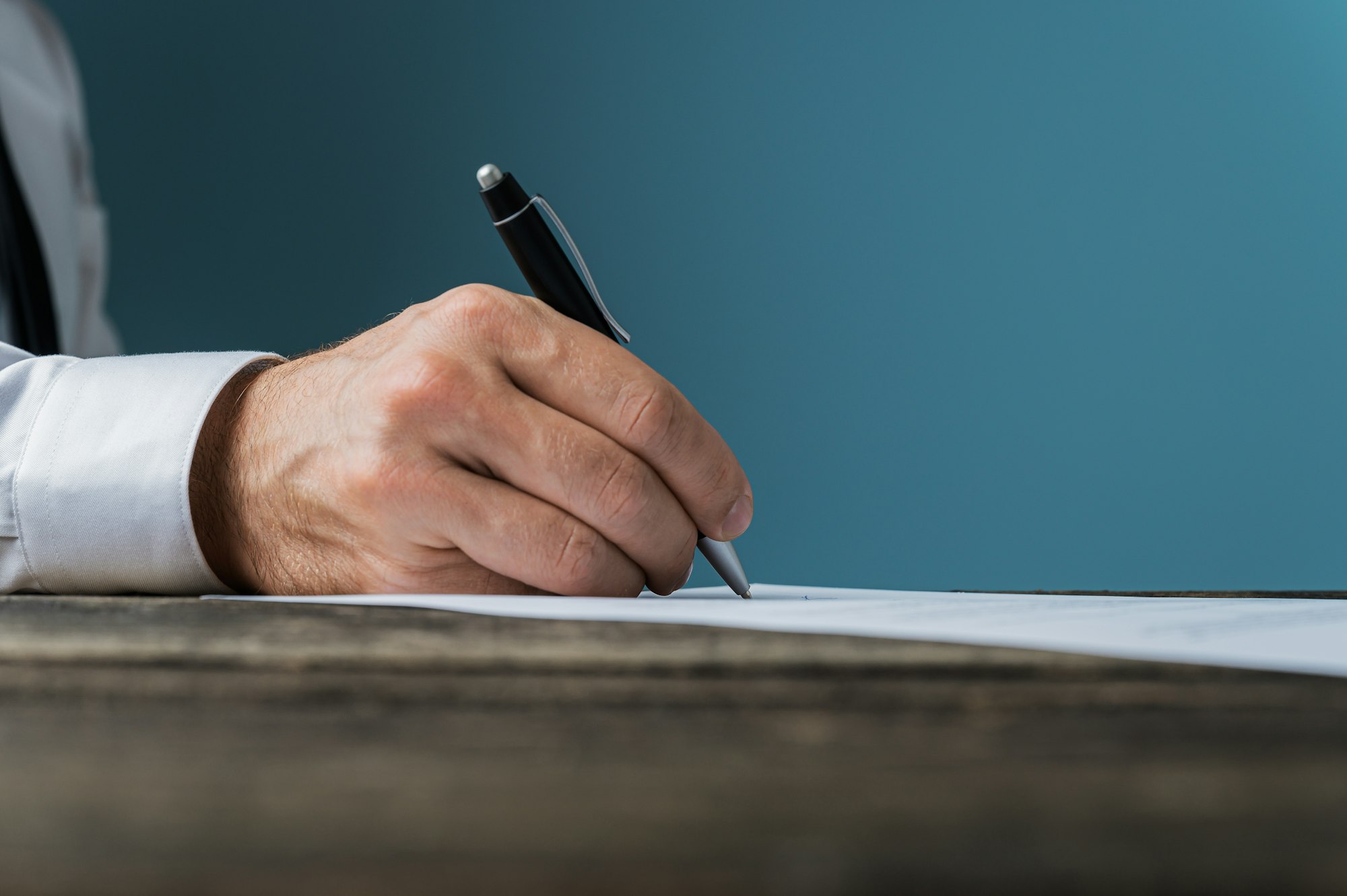 Businessman or lawyer signing a document